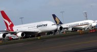 File photo shows a Qantas Airbus A380 (L) and a Singapore Airlines' A380 (R) at Sydney International Airport. Australian carrier Qantas and Singapore Airlines Friday reassured passengers there was no risk to safety after cracks were found on the wings of several A380 superjumbos, including some in their fleets File photo shows a Qantas Airbus A380 (L) and a Singapore Airlines' A380 (R) at Sydney International Airport. Australian carrier Qantas and Singapore Airlines Friday reassured passengers there was no risk to safety after cracks were found on the wings of several A380 superjumbos, including some in their fleets