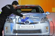 This file picture shows a worker cleaning a Toyota Hybrid Prius during an auto show. The Australian arm of Japanese auto giant Toyota announced Monday that it would sack 350 workers at its southern carmaking plant, citing 