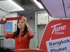 An AirAsia flight attendant is pictured on a flight in Thailand, December 18, 2012.
