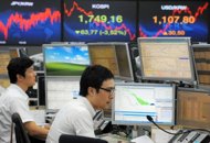 Traders monitor exchange rates in a dealing room at the Korea Exchange Bank in Seoul, 2011. Asian stocks rose, shrugging off concerns about the eurozone's debt crisis as a batch of rosy US economic data buoyed investor sentiment with the Dow hitting a near four-year high Traders monitor exchange rates in a dealing room at the Korea Exchange Bank in Seoul, 2011. Asian stocks rose, shrugging off concerns about the eurozone's debt crisis as a batch of rosy US economic data buoyed investor sentiment with the Dow hitting a near four-year high
