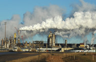 View of the Syncrude oil sands extraction facility near the town of Fort McMurray in Alberta Province, Canada, in 2009. Canada has threatened to lodge a World Trade Organization complaint against the European Union if the bloc labels oil from Alberta's tar sands as highly polluting, documents published Monday show.