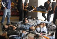 Commuters lie on stretchers after sustaining injuries when their train crashed into the Once station at rush hour in Buenos Aires February 22, 2012. Transport Secretary Juan Pablo Schiavi confirmed that 340 people were injured and that passengers were still trapped inside when the train's brakes failed. REUTERS/Enrique Marcarian Commuters lie on stretchers after sustaining injuries when their train crashed into the Once station at rush hour in Buenos Aires February 22, 2012. Transport Secretary Juan Pablo Schiavi confirmed that 340 people were injured and that passengers were still trapped inside when the train's brakes failed. REUTERS/Enrique Marcarian