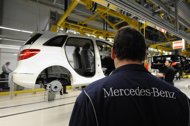 Local workers prepare to complete a car in the new factory of German carmaker Daimler AG Mercedes-Benz in Kecskemet, about 90 km east of Budapest. Local workers prepare to complete a car in the new factory of German carmaker Daimler AG Mercedes-Benz in Kecskemet, about 90 km east of Budapest.