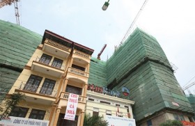 Real estate troubles raise serious debate