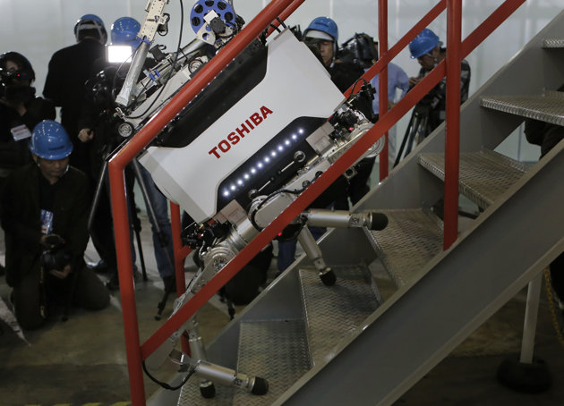 Toshiba Corp.'s nuclear Inspection robot climbs stairs during a demonstration at a Toshiba factory in Yokohama, west of Tokyo, Wednesday, Nov. 21, 2012. The four-legged robot is designed to help at the meltdown-crippled Japanese nuclear plant, climbing over debris and venturing into radiated areas off-limits to human workers. (AP Photo/Itsuo Inouye) Toshiba Corp.'s nuclear Inspection robot climbs stairs during a demonstration at a Toshiba factory in Yokohama, west of Tokyo, Wednesday, Nov. 21, 2012. The four-legged robot is designed to help at the meltdown-crippled Japanese nuclear plant, climbing over debris and venturing into radiated areas off-limits to human workers. (AP Photo/Itsuo Inouye)